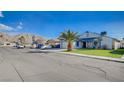 Inviting single-Gathering home features a well-maintained lawn, and mature palm tree on a sunny day at 5767 Tabitha Ave, Las Vegas, NV 89156