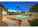 Inviting backyard oasis with a sparkling pool and relaxing patio at 5840 N El Capitan Way, Las Vegas, NV 89149