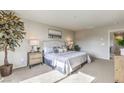 Bright and spacious bedroom with a large bed and neutral decor at 8405 Sycamore Creek St, Las Vegas, NV 89148