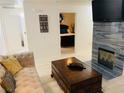 Bright living room featuring a fireplace and access to bedroom at 9050 W Warm Springs Rd # 1137, Las Vegas, NV 89148