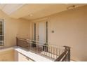 Private condo entry with a door and balcony access at 9204 Tesoras Dr # 401, Las Vegas, NV 89144