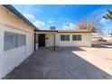 Side view of a single story home with a large yard and driveway at 2113 La Harve Dr, Las Vegas, NV 89106