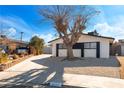 Front view of a renovated single story home with new landscaping at 2113 La Harve Dr, Las Vegas, NV 89106