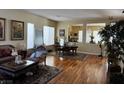 Spacious living room with hardwood floors and a formal dining area at 2273 Moresca Ave, Henderson, NV 89052