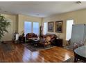 Bright living room featuring hardwood floors and ample natural light at 2273 Moresca Ave, Henderson, NV 89052