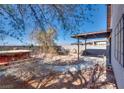 Private backyard with a covered patio, spa, and desert landscaping, perfect for outdoor entertaining at 2935 Kensington St, Las Vegas, NV 89156