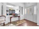 Bright and airy entryway with a half wall separating it from the dining area at 348 Wild Plum Ln, Las Vegas, NV 89107