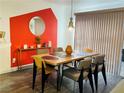 Dining area with wood table, chairs, and an accent wall at 3495 Greenwood Springs Dr, Las Vegas, NV 89122