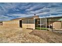 Backyard featuring gravel, an enclosed patio, and desert landscaping at 360 S Blagg Rd, Pahrump, NV 89048