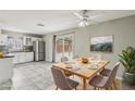 Kitchen dining area with table and chairs, slider to backyard at 3701 Guinevere Ave, Las Vegas, NV 89110