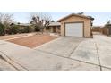 Front yard view of house with driveway and garage at 3701 Guinevere Ave, Las Vegas, NV 89110