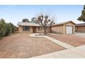 Single story home with attached garage and mature tree at 3701 Guinevere Ave, Las Vegas, NV 89110