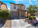 Two-story house with attached garage and landscaping at 4204 Becket Ct, Las Vegas, NV 89129