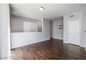 Bright living room with hardwood floors and a half-wall at 7167 S Durango Dr # 203, Las Vegas, NV 89113