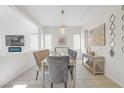 Elegant dining room with a chandelier and modern decor at 8 Hilltop Crest St, Henderson, NV 89011