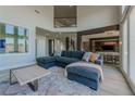 Open living area showcasing a comfortable sectional sofa and high ceilings at 8120 Castle Pines Ave, Las Vegas, NV 89113