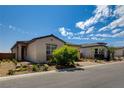 Two story home with attached garage, landscaping, and a paved driveway at 9016 Skye Canyon Ranch St, Las Vegas, NV 89166