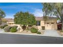 Single-story home with two-car garage and well-maintained landscaping at 9092 National Park Dr, Las Vegas, NV 89178