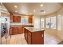 Eat-in kitchen featuring stainless steel appliances, a center island, and a breakfast nook at 9328 Freedom Heights Ave, Las Vegas, NV 89149