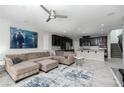 Open living room featuring a large sectional sofa and stylish rug at 1015 Solana Crest St, Henderson, NV 89052