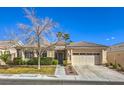 Charming single-story home with a tile roof, mature landscaping, and an attached two-car garage at 1104 Bower Basin St, Las Vegas, NV 89144
