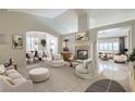 Bright and airy living room featuring a fireplace, high ceilings, and elegant furnishings at 1104 Bower Basin St, Las Vegas, NV 89144