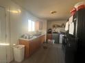 View of kitchen with wood cabinets and appliances at 1900 W Carey Ave, North Las Vegas, NV 89032