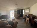 Living room with brown couches and a recliner at 1900 W Carey Ave, North Las Vegas, NV 89032