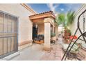 Charming courtyard with seating area and palm tree at 2256 Sabroso St, Las Vegas, NV 89156