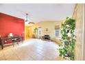 Bright living room with fireplace and tile floors at 2256 Sabroso St, Las Vegas, NV 89156