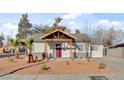 Charming single-story home with a striking red door and xeriscaped front yard at 240 S 16Th St, Las Vegas, NV 89101