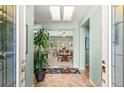 Bright and airy entryway with views into the living and dining areas at 2563 Collinsville Dr, Henderson, NV 89052