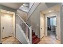 Bright entryway with staircase, wood flooring, and access to other rooms at 2671 Colina Bella Ct, Las Vegas, NV 89142