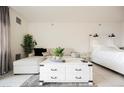 Open-concept studio apartment with comfy seating and a white bed at 29 Montelago Blvd # 337, Henderson, NV 89011