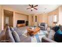 Spacious living room featuring comfortable seating and a large TV at 2915 Rippling Springs St, Laughlin, NV 89029