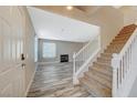 Entryway with staircase, wood-look floors and fireplace at 5040 Sublight Ave, Las Vegas, NV 89108