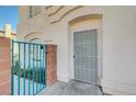 Front entrance with a security gate and door at 5040 Sublight Ave, Las Vegas, NV 89108