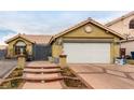 House exterior featuring a brick walkway and attached garage at 6442 Cedar Breaks Ave, Las Vegas, NV 89156