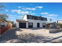 Newly renovated two-story house with a modern look and spacious driveway at 705 N Torrey Pines Dr, Las Vegas, NV 89107