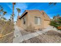Tan house with a two-car garage and walkway at 7908 Mountain Point Ave, Las Vegas, NV 89131