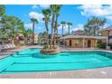 Community pool with palm trees and lounge chairs at 7950 W Flamingo Rd # 1041, Las Vegas, NV 89147