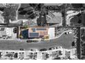 Overhead view of home featuring a tile roof, solar panels, and a spacious driveway at 8736 Summoners Ct, Las Vegas, NV 89139
