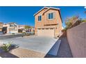 Inviting two-story home featuring a spacious driveway and attached two-car garage at 8736 Summoners Ct, Las Vegas, NV 89139