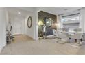 Elegant dining room boasts modern chandelier, textured wallpaper, and stylish furniture at 10116 Rebel Coast St, Las Vegas, NV 89141