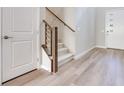 Light and bright entryway with stairs and hardwood floors at 11904 Vector Ray Ave, Las Vegas, NV 89138