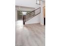 Modern staircase and luxury vinyl plank flooring in entryway at 1225 Crimson Sunbird St, North Las Vegas, NV 89084