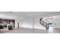 Open concept kitchen with island and stainless steel appliances at 1225 Crimson Sunbird St, North Las Vegas, NV 89084