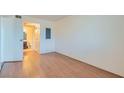 Bedroom with wood flooring and a view of the bathroom at 1361 E University Ave # 209, Las Vegas, NV 89119