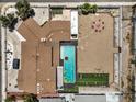 Aerial shot of a home with a pristine backyard pool, patio, outdoor kitchen, and landscaped garden at 1420 S 8Th St, Las Vegas, NV 89104