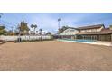 Large backyard with pool, weight training equipment, and minimalist landscaping at 1420 S 8Th St, Las Vegas, NV 89104